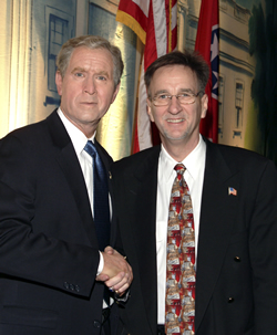President Bush impersonator withSecret Service Singers